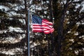 Badly tattered American flag flying from flagpole outside Royalty Free Stock Photo
