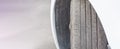 Badly worn out car tire tread and damaged bulb like side due to wear and tear or because of poor tracking or alignment of the Royalty Free Stock Photo