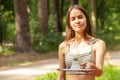 Badminton, activity game, girl holding a racket with a shuttlecock, a player on the court, competitions and outdoor sports Royalty Free Stock Photo