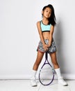 Badminton asian girl posing with racket full length portrait Royalty Free Stock Photo