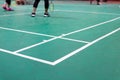 badminton court with player in game Royalty Free Stock Photo