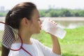 Athletic woman drinking water outdoors Royalty Free Stock Photo