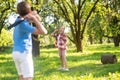 Girl and boy playing badminton in park Royalty Free Stock Photo