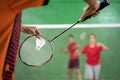 Badminton player holding a shuttlecock ready to serve Royalty Free Stock Photo