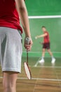 A badminton player& x27;s hand holding a racket while playing badminton Royalty Free Stock Photo