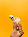 Badminton racket and green Feather Shuttlecock with a  colour white background stock isolated image. Royalty Free Stock Photo