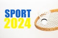 Badminton racket and shuttlecock on a white background and the text Sport 2024 in the yellow-blue light of the Ukrainian Royalty Free Stock Photo