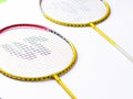 Badminton racket and White Feather Shuttlecock with a colour white background stock isolated image.