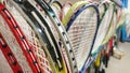 Badminton rackets stored in games cupboard close up