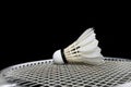 Badminton shuttlecock and racket on grass and black background Royalty Free Stock Photo