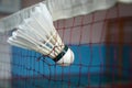 Badminton shuttlecock stuck on net Royalty Free Stock Photo