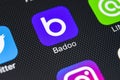 Badoo application icon on Apple iPhone X screen close-up. Badoo app icon. Badoo is an online social media network. Social media