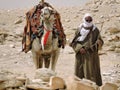 An Egyptian camel driver and his camel.