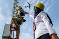 Badung, Bali, Dec 8th 2020: In a clearly day, 2 female technical workers repairing communication equipment at the airport. One of