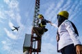 Badung, Bali, Dec 8th 2020: In a clearly day, 2 female technical workers repairing communication equipment at the airport. One of