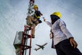 Badung, Bali, Dec 8th 2020: In a clearly day, 2 female technical workers repairing communication equipment at the airport. One of