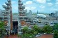 Badung, Bali, Indonesia, Oct 6 2020: Garuda Indonesia airplane passengers pass through the arrival gate in the form of a Balinese