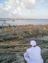 BADUNG/BALI-MAY 11 2018: a Hindu priest was bringing mobile phone and looking at the construction at the international airport