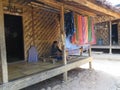 BADUY VILLAGE/INDONESIA - SEPTEMBER 27, 2014: Baduy women weaving traditional cloth