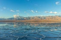 Badwater Basin and Telescope Peak. Salt Crust and Clouds Reflection. Death Valley National Park. California, USA