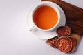 Bael fruit juice and dried quince on a white background