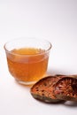 Bael fruit juice and dried quince on a white background