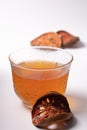 Bael fruit juice and dried quince on a white background