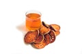 Bael fruit tea and slices of dried bael fruit, tea matum isolated on white Royalty Free Stock Photo