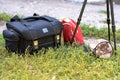 Bag for the camera, a tripod and a red backpack. Kit for the photographer for travel.