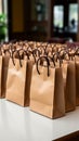 Bag collection: Assorted brown paper bags arranged gracefully on the table\'s surface.