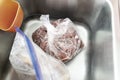 Bag of defrosted beef cubes for african pepper stew Royalty Free Stock Photo