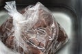 Bag of defrosted beef cubes for african pepper stew Royalty Free Stock Photo