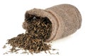 Bag of dried tarragon in close-up on white background