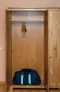 Bag in empty wooden wardrobe Royalty Free Stock Photo
