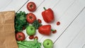 bag of fresh vegetables on a light wooden background . Royalty Free Stock Photo