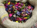 Bag full of buttons made with colored palm seeds