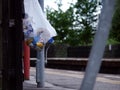 Bag of garbage hanging on railway train station