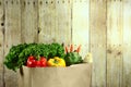 Bag of Grocery Produce Items on a Wooden Plank