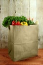 Bag of Grocery Produce Items on a Wooden Plank Royalty Free Stock Photo
