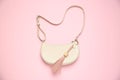 Bag with leather keychain on pink background, top view Royalty Free Stock Photo