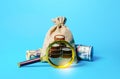 Bag with money and magnifying glass. Investigating capital origins. Deposit or loan terms and conditions. Anti money laundering,