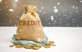 Bag with money and tape measure and the word Credit. Christmas Loans. Low interest rates. Favorable offers for borrowers. Consumer Royalty Free Stock Photo