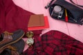 bag, passport, camera, compass, shoes, shirt, note pad on pink wooden background Royalty Free Stock Photo