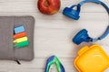 Bag-pencil case with color felt pens and marker, apple, stapler, headphones and lunch box Royalty Free Stock Photo