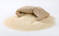 Bag and pile of white long grained rice