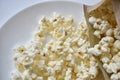 A bag of popcorn open on a plate in the kitchen Royalty Free Stock Photo