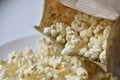 A bag of popcorn open on a plate in the kitchen Royalty Free Stock Photo