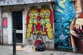 Rubbish in the street & surreal street art mural in East London