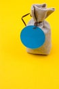 Bag of sackcloth with a blue tag Royalty Free Stock Photo
