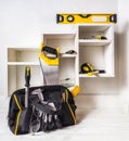 Bag with a set of tools. The installation of furniture drawers